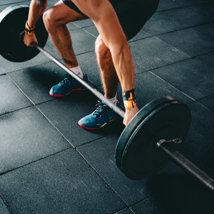 men lifting weights, exercising